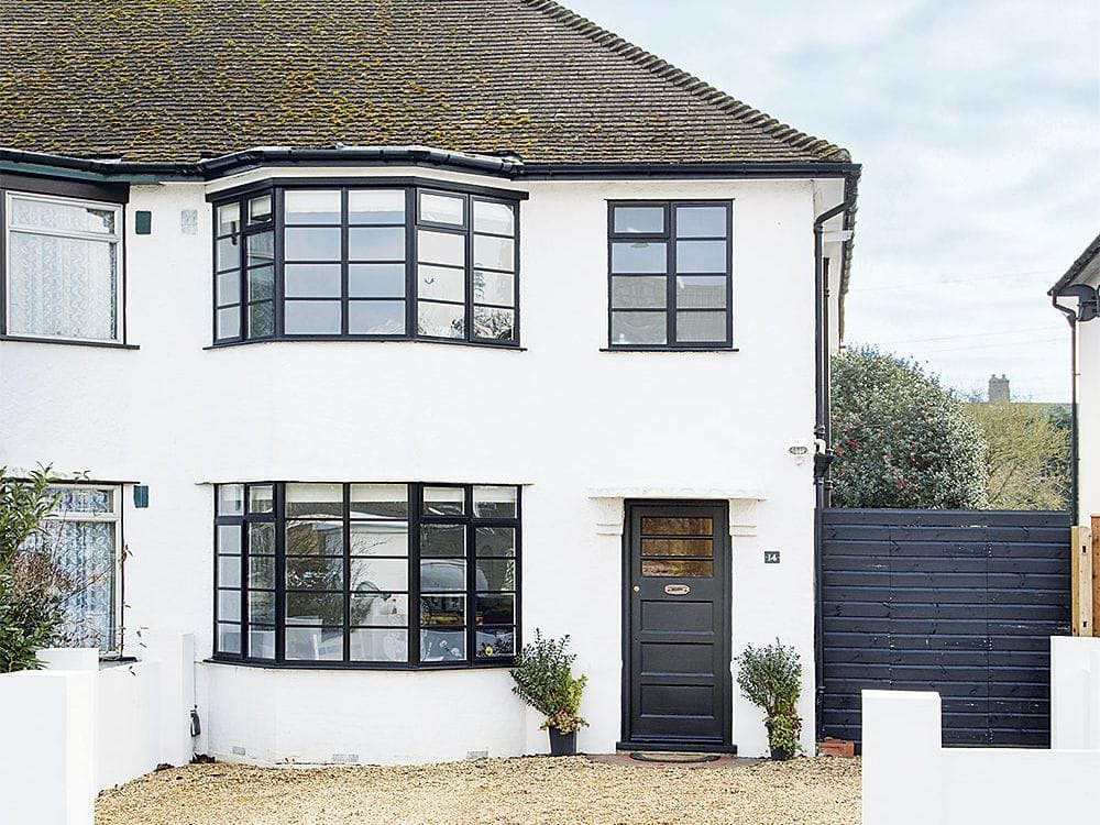 Complete exterior painting with proper repainted and restored windows and doors for a 1930s semi-detached house in suburban London.