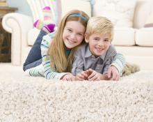 boy and girl on floor after carpet cleaning in Pearland TX
