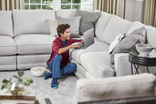 boy by couch after a carpet cleaning in spring tx