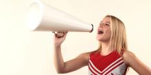 cheerleader cheering using megaphone