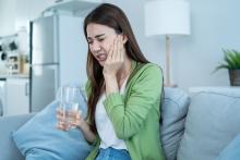 girl suffering from intense jaw pain