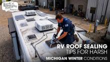 A Male Technician Sealing the Roof of Class A Motorhome