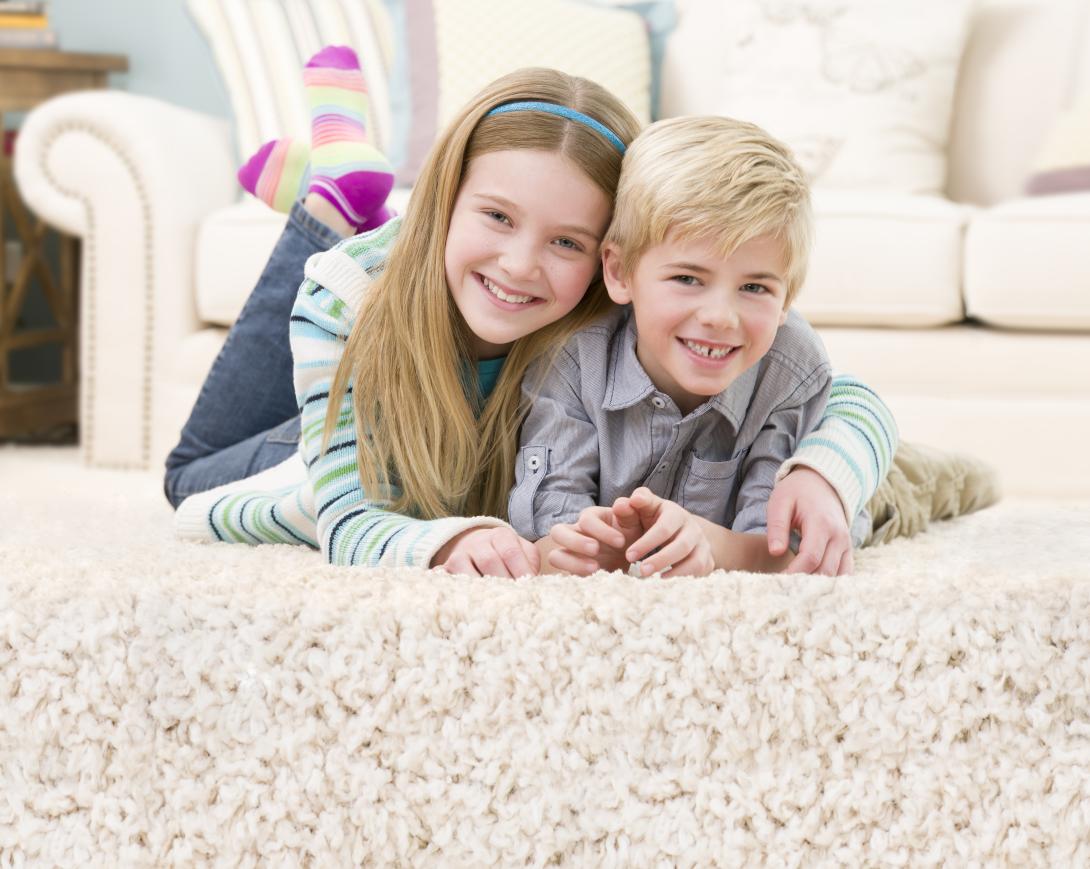 boy and girl on floor after carpet cleaning in Pearland TX