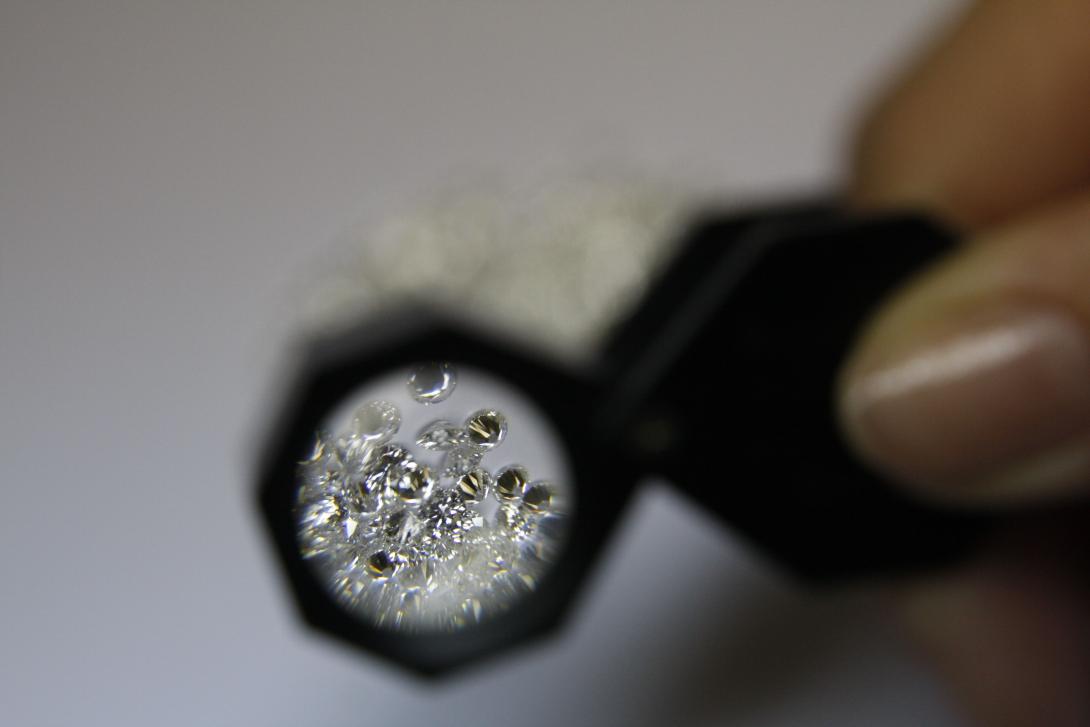 Person using a magnifying lens